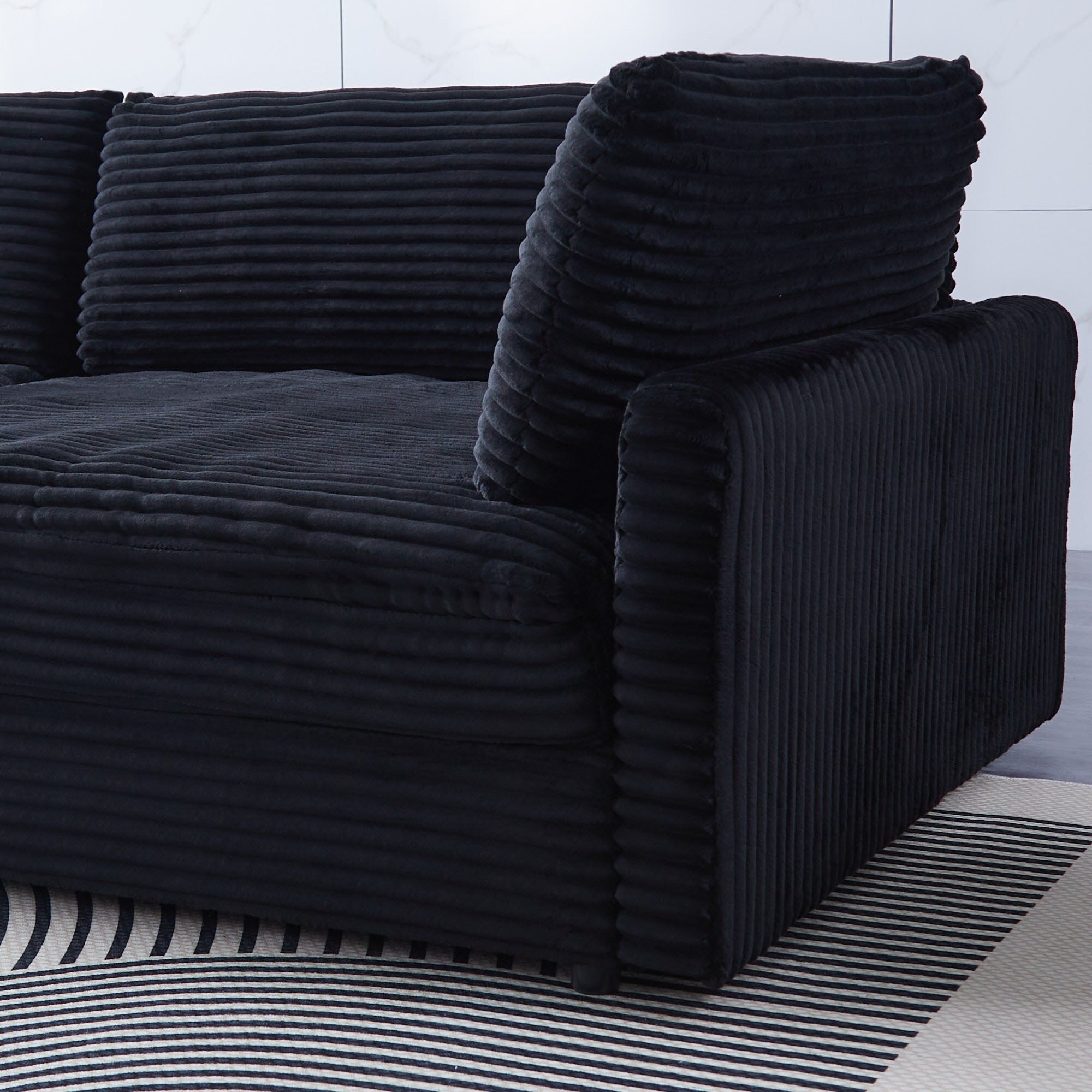 112-inch black corduroy sofa: two throw pillows, four backrests, opening up a new style for the living room's casual area